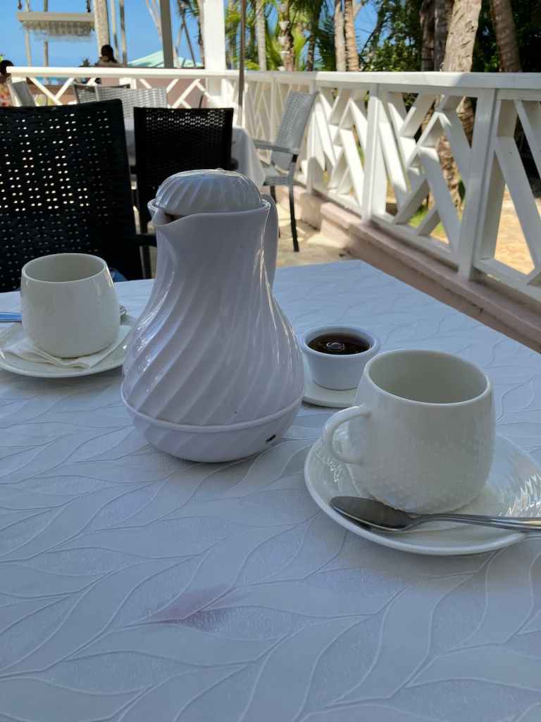 Tea kettle and cups on table