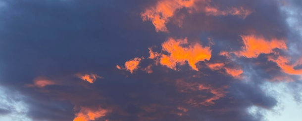 Cloudy sky with orange light